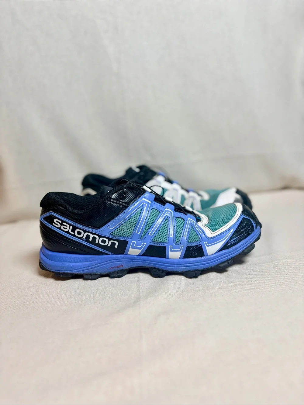 Salomon woman’s Sneakers in Teal, Blue, White and Black size 10